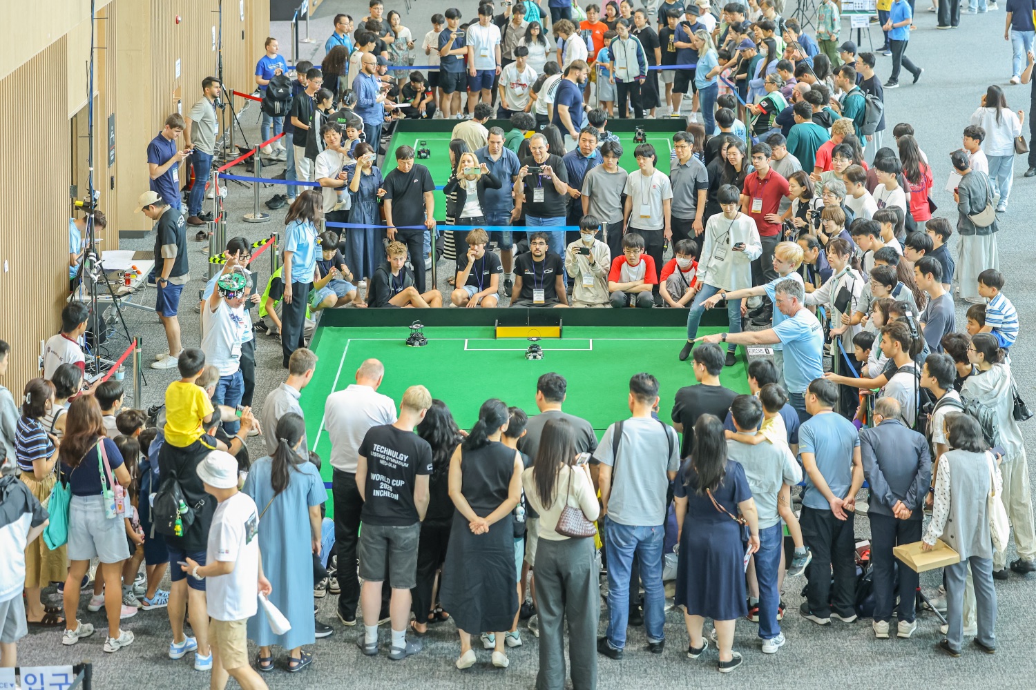 RoboCupJunior soccer at RoboCup 2026 — Junior teams fielding a combined “superteam,” the same idea behind a Small Size League squad.